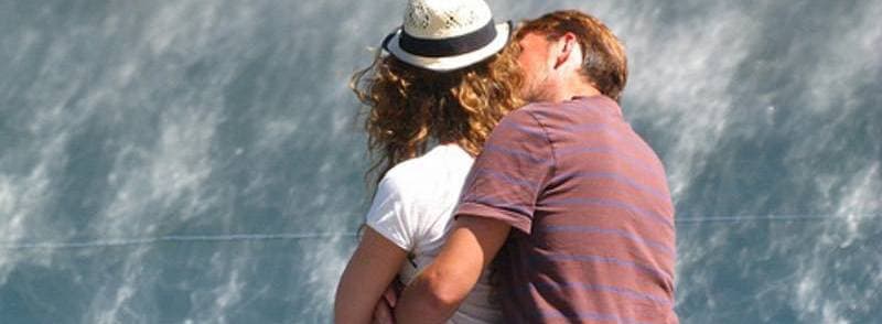 rear view of seated couple embracing